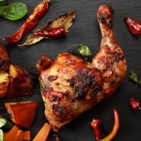 Roasted,Chicken,Leg,With,Roast,Potatoes,And,Vegetables